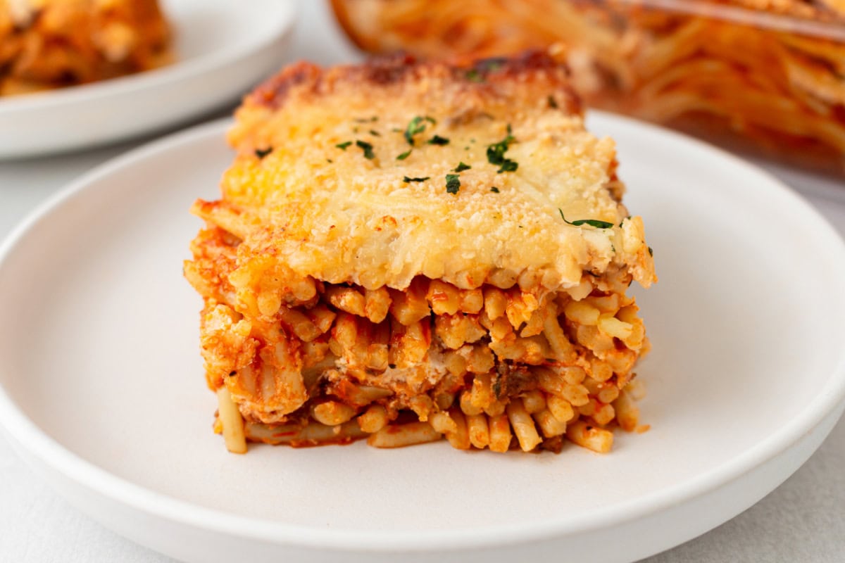 slice of million dollar baked spaghetti on plate